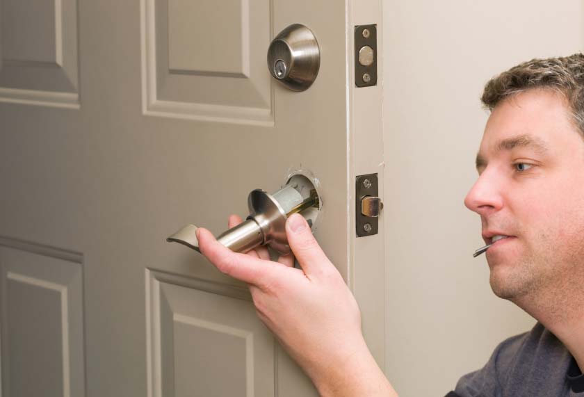 man installing lock