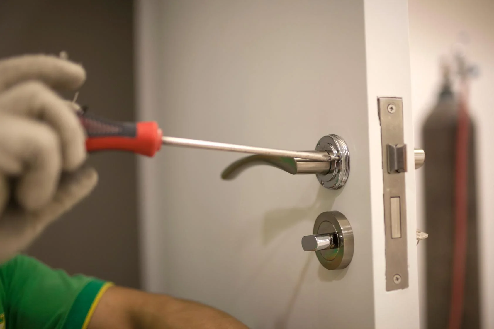 man installing lock