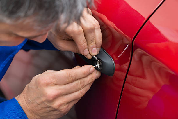 man repair car handle lock