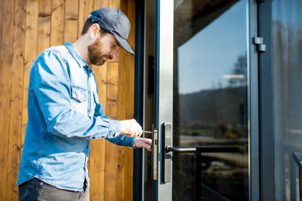 person repairing office door lock